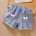 Rosa und gelbe geknotete Shorts